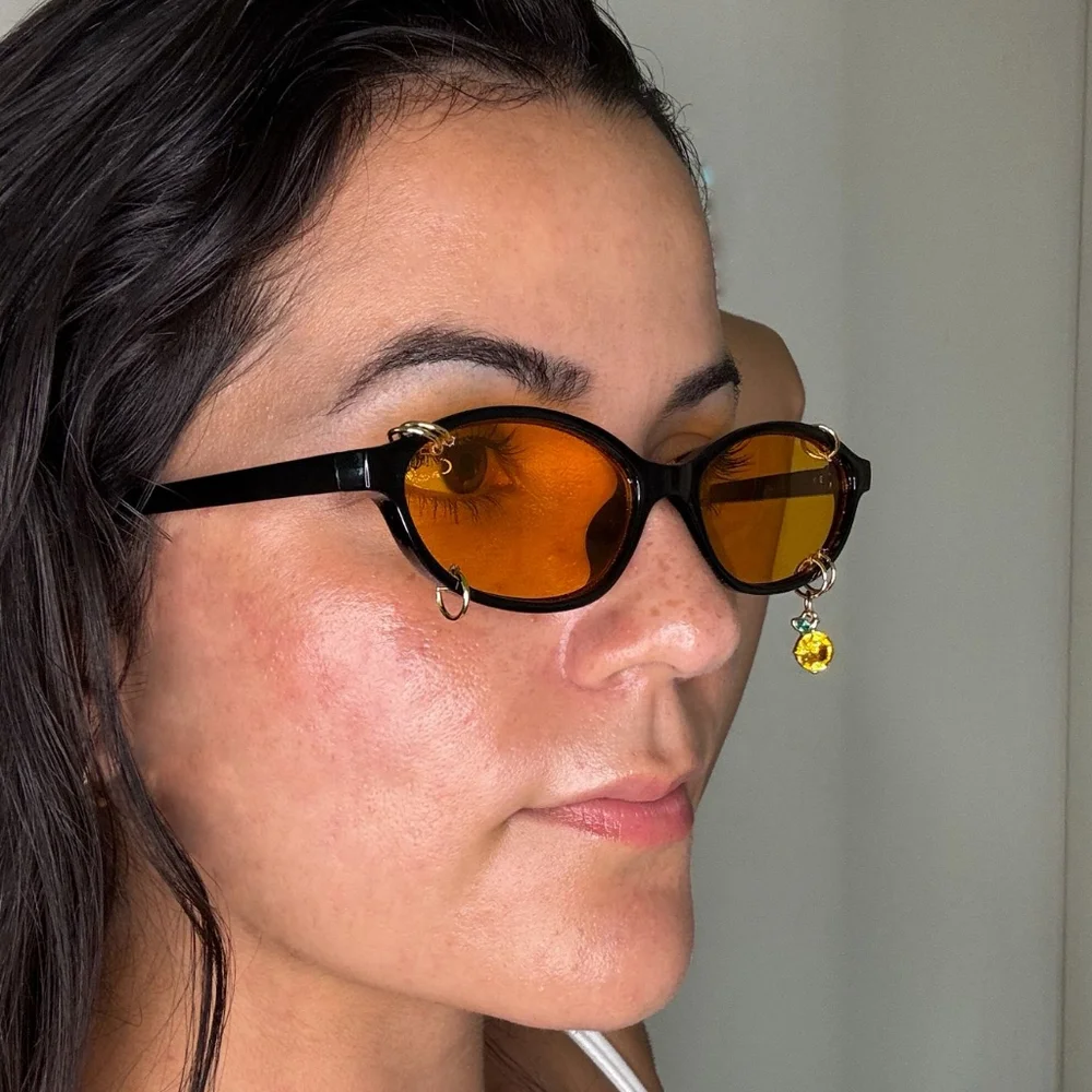 Black Oval Cat Eye Orange Shade Sunglasses Gold Piercings and Orange Fruit Charm - Picture 3 of 5